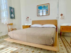 Posteľ alebo postele v izbe v ubytovaní DOMUS ALERIA Deluxe Rooms