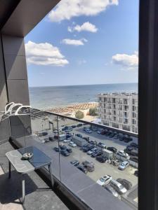 a balcony with a view of a parking lot at Apartament Palma 2 Stefan Resort in Mamaia Sat/Năvodari