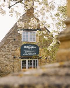 a building with a sign on the side of it at The Ebrington Arms in Chipping Campden
