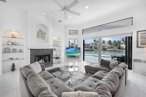 a living room with a couch and a fireplace at 951 Ruby Court in Marco Island