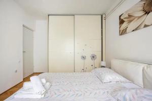 a bedroom with a bed and a large closet at Apartment Tomas,,,Spacious house with private parking,terrace,5G Internet,,,,, in Zadar