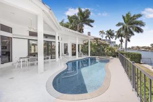 an exterior view of a house with a swimming pool at 951 Ruby Court in Marco Island