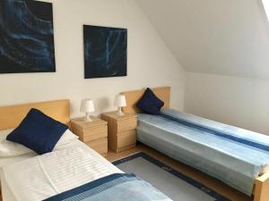 Ліжко або ліжка в номері Gösser BACHGASSLHOF -- Bed and Breakfast -- Apartments