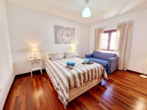 Łóżko lub łóżka w pokoju w obiekcie Casa Daniela en Costa Teguise