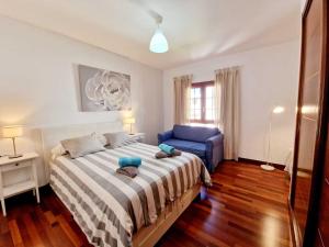 Łóżko lub łóżka w pokoju w obiekcie Casa Daniela en Costa Teguise