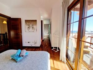 Łóżko lub łóżka w pokoju w obiekcie Casa Daniela en Costa Teguise