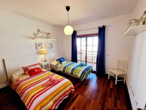 Łóżko lub łóżka w pokoju w obiekcie Casa Daniela en Costa Teguise