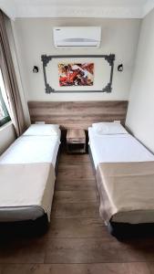 Postel nebo postele na pokoji v ubytování Kutberk Hotel Kemer
