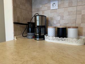 a group of coffee cups sitting on a counter at Family Apartment in Nea Moudania +41 photos