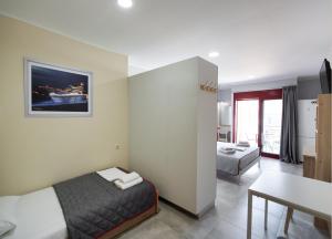 Ein Bett oder Betten in einem Zimmer der Unterkunft Excess Pansion