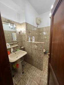 a bathroom with a sink and a mirror at Affittacamere da Elio e Renata in Calvi dellʼ Umbria