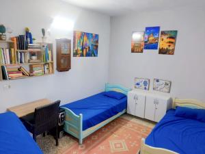 Voodi või voodid majutusasutuse Blue hostellerie toas