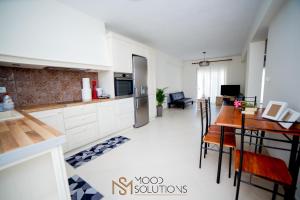 a kitchen and dining room with a table and chairs at Polys Polychrono MoodSolutions Living in Polychrono