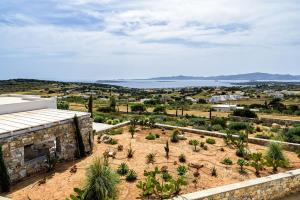 a view from the roof of a house with plants at Stunning new villa with great pool area, magnificent panoramic sea view - Paros in Angairiá
