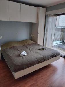 Ένα ή περισσότερα κρεβάτια σε δωμάτιο στο Appartement voor gezin
