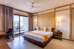 Shervani Pebbles & Pines Resort & Spa, Corbett客房内的一张或多张床位