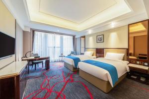 Katil atau katil-katil dalam bilik di Xi'an Lanxi International Hotel