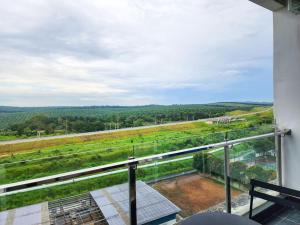 a balcony with a view of a field at Railway Stylish Homestay (3BR3B) 6pax by Cowidea in Johor Bahru