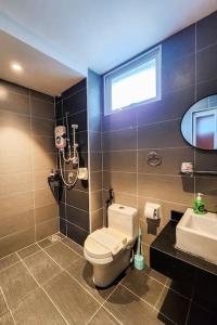 a bathroom with a toilet and a sink at Railway Stylish Homestay (3BR3B) 6pax by Cowidea in Johor Bahru
