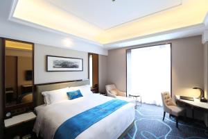 Katil atau katil-katil dalam bilik di Xi'an Lanxi International Hotel