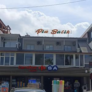 a building with a sign on top of it at Pia Butik Otel Sığacık in İzmir