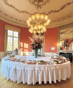 a table in a room with food on it at Bernstorff Castle Hotel in Gentofte