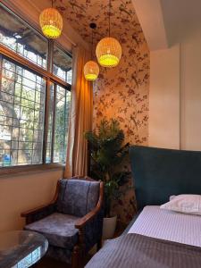 Ένα ή περισσότερα κρεβάτια σε δωμάτιο στο Rio : Cozy 1Bhk in Koregaon Park. WiFi AC King Bed +8 φωτογραφίες