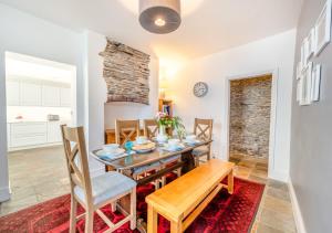 a dining room with a table and chairs at South Street Farm in Braunton