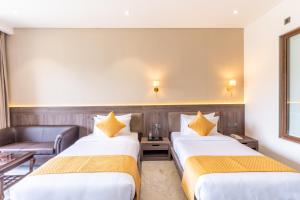 Shervani Pebbles & Pines Resort & Spa, Corbett客房内的一张或多张床位