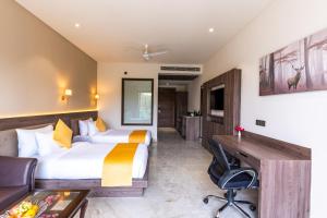Shervani Pebbles & Pines Resort & Spa, Corbett客房内的一张或多张床位