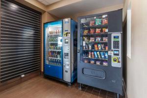 a vending machine with soda and drinks in a room at Comfort Inn & Suites Aberdeen in Aberdeen