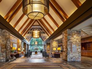 a lobby of a resort with a large ceiling at Fairmont Chateau Whistler in Whistler
