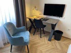 TV a/nebo společenská místnost v ubytování Dom Hotel