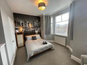 Postel nebo postele na pokoji v ubytování Delightful home in Manchester + 12 fotografií