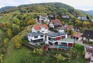 an aerial view of a house on a hill at Ferienhaus mit Panoramablick in Bühlertal