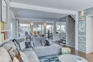 a living room with a couch and a table at Chalet Farniente in Praz-sur-Arly