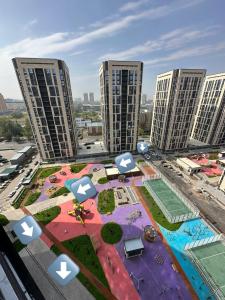 an aerial view of a city with tall buildings at Yourhome - #105 Комфорт сити in Almaty