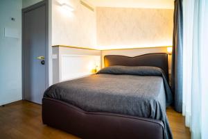 Posteľ alebo postele v izbe v ubytovaní Villino Milano