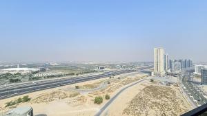 an aerial view of a city with a highway at Executive studio in Dubai