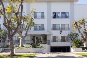a white building with trees in front of it at Beverly Hills 1BR w Pool nr Beverly Center LAX-280 in Los Angeles