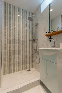 a bathroom with a shower and a sink at Casa Ifestou in Rhodes Town