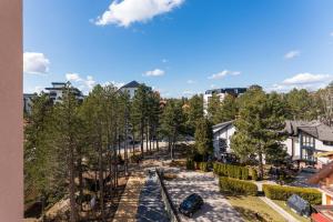 an aerial view of a street with trees and buildings at Akik in Zlatibor