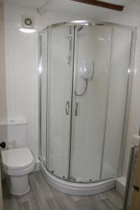 a bathroom with a shower and a toilet at Hawthorn in Crayke YO61 4TE in York