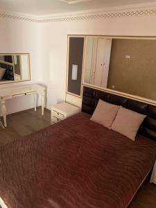 En eller flere senge i et værelse på Penthouse Happy Moments 4