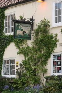 a sign hanging on the side of a building at Hawthorn in Crayke YO61 4TE in York