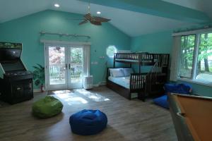 a room with a bedroom with a bunk bed at Catskills Lakefront Escape with Hot Tub in Monticello