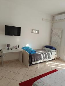 Posteľ alebo postele v izbe v ubytovaní L'appartamento delle vacanze