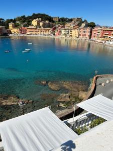 a view of a large body of water with buildings at Hotel Helvetia in Sestri Levante