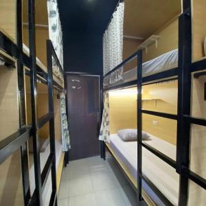 a dorm room with bunk beds in it at Innbox Hostel in Sorong