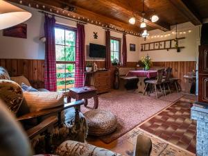 a living room with a couch and a table at Chalupa Žárovička in Velké Losiny